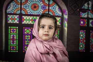 happy muslim girl with full hijab in pink dress , asian traditional style dress , praying inside the mosque and holy Allah