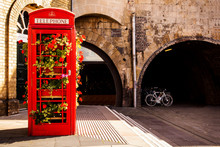 Traditional English Telephone Box With Flowers. Bath, England, UK.