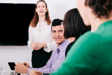 Wall Mural - Group of office workers at a meeting around the boss