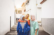 © Alessandro Biascioli - Happy Muslim women walking in the city center - Arabian young girls having fun spending time and laughing together outdoor - concept of lifestyle people culture and religion