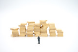 Fototapeta Do przedpokoju - Miniature people standing on stack of wood Investment Analysis Or big data Analysis. as background business concept ,big data concept and Money, Financial, Business Growth concept with copy space.