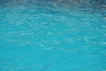 Blue Water Background. Water surface texture. Blue water ripple surface