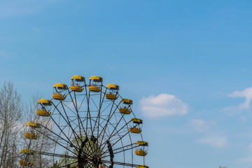 Abandoned Pripyat amusement park. Due to the Chernobyl nuclear explosion it was never open. A close up on a big marry-goes-round, ferry wheel. Abandoned lunapark. .