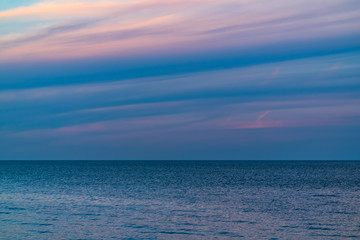Wall Mural - blue sea with the skyline at twilight