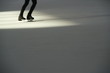 © Avishay - Glides on the ice. A woman slides on the ice.