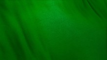 Green Flag Cloth In Full Frame With Selective Focus. 3D Illustration Of Viridescent Grassy Colored Garment With Clean Natural Linen Texture For Background Banner Or Wallpaper Use.