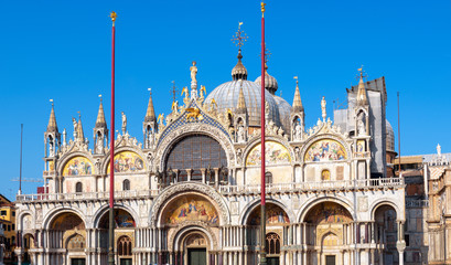 Wall Mural - St Mark’s Basilica in sunset light, Venice, Italy. Famous Saint Mark’s church is top landmark of Venice.