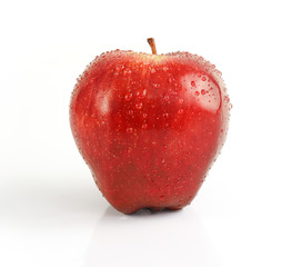 Water drop Red apple isolated on white background with clipping path.