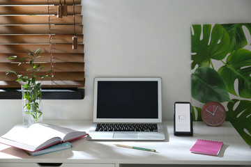 Modern workplace and smartphone charging with wireless pad