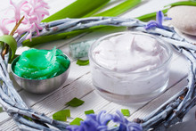 Cosmetic Cream Product Samples With Hyacinth Flowers On White Wooden Background