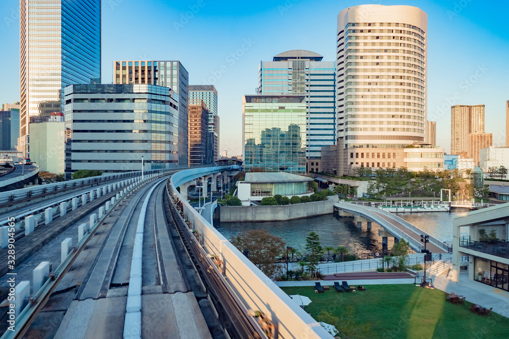 Japan. Bridge over the river in Tokyo. Railway bridge in Japan top view. Bridge for metro trains runs next to skyscrapers. Train traffic in downtown Tokyo. Architecture of the Japanese city.