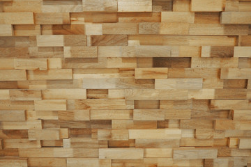 Beautiful wooden blocks wall with texture and rough surface in warm brown tone for background and decoration. 