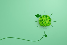 Green Crumpled Paper Light Bulb On Green Background, Corporate Social Responsibility (CSR), Eco-friendly Business And Environmental Concept