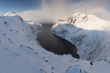 Wall Mural - Panorama of snowy fjords and mountain range, Senja, Norway Amazing Norway nature seascape popular tourist attraction. Best famous travel locations. beautiful sunset within the amazing winter landscape