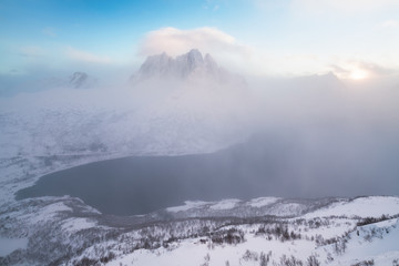 Wall Mural - Panorama of snowy fjords and mountain range, Senja, Norway Amazing Norway nature seascape popular tourist attraction. Best famous travel locations. beautiful sunset within the amazing winter landscape