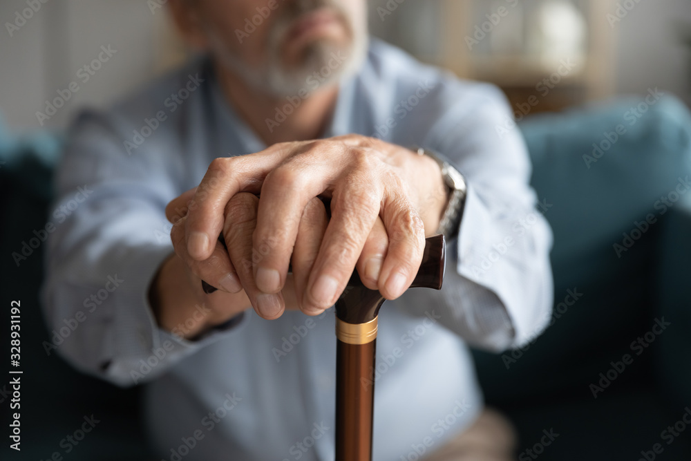 Close up of old man hands hold wooden cane look in distance thinking pondering, disabled mature 60s male feel lonely abandoned lost in thoughts missing mourning, elderly solitude concept - obrazy, fototapety, plakaty 