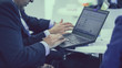 © Aris Suwanmalee - Businessman Working On His Laptop