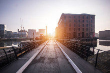 The Albert Dock Area Of Liverpool Just After Sunrise, With Low Sun And Long Shadows