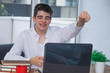 © carballo - male teenage student at desk with computer and books studying