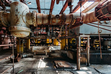 Old Rusty Industrial Tanks Connected By Pipes Connected With Valves In Abandoned Chemical Factory