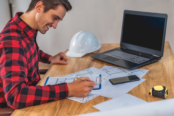 Wall Mural - civil engineer at his Desk working with documents