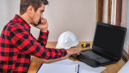 Wall Mural - civil engineer at his Desk working with documents