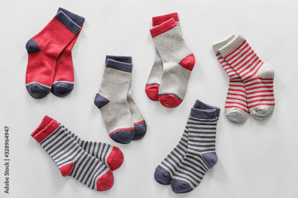 Different cotton socks on white background