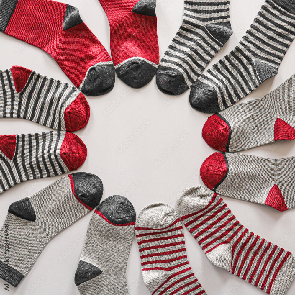 Different cotton socks on white background