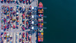 Aerial view container cargo ship freight shipping unloading at original destination port with quay crane, Business commercial global oversea logistic import export container box by container vessel .