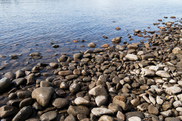 Wall Mural - Pebble stone background. Sea Pebble. Beach stones. Natural background. Stone texture. Coast