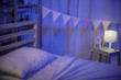 © DN6 - Positive minimalist and colorful room for kids and teenagers in a dark bedroom at night