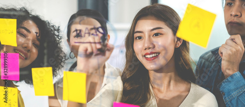 Fotomural Banner of asian creative woman smiling and meeting at office use post it notes to share idea and planning project