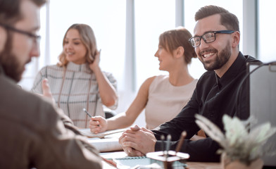 Wall Mural - smiling businessman at a working meeting in the office