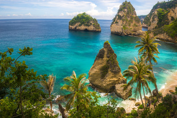 Wall Mural - beautiful aerial view of tropical paradise beach and rock cliff with amazing turquoise sea water and palm trees in Summer holidays travel destination and exotic vacations trip