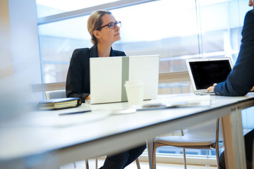 Wall Mural - Executive people working on laptop in meeting room