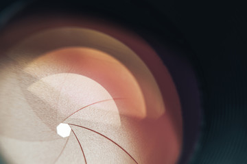Aufkleber - Beautiful camera lens with orange  light of glass. Background pattern for design..