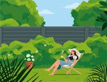 Girl With A Cup Reads A Book While Sitting On A Deck Chair In The Garden.
