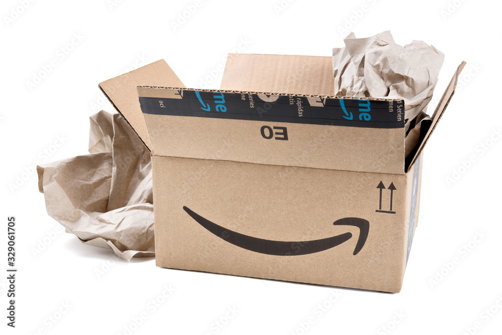 Amazon Prime cardboard box open with wrapping paper on white background ...