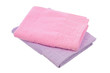 purple and pink towels lie on a white background of isolate