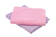 purple and pink towels lie on a  isolate