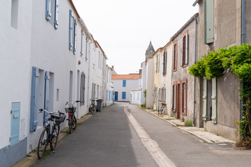 Wall Mural - Street alley typical with bike bicycle front house white in island Noirmoutier Vendee France