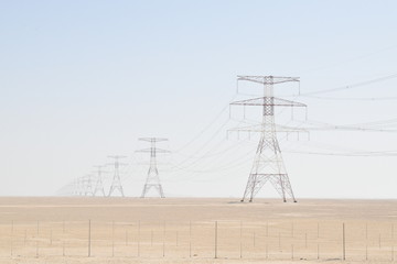 electric tower in the middle of the desert in Abu Dhabi.