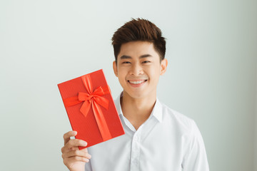 Wall Mural - Cheerful young man in present boxes.