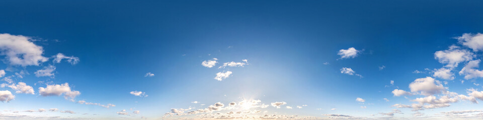 Seamless hdri panorama 360 degrees angle view blue sky with beautiful fluffy cumulus clouds with zenith for use in 3d graphics or game development as sky dome or edit drone shot