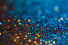 Festive Twinkle Glitters Background, Abstract Glowing Backdrop With Circles,modern Design Wallpaper With Sparkling Glimmers. Blue And Golden Backdrop Glittering Sparks With Glow Effect