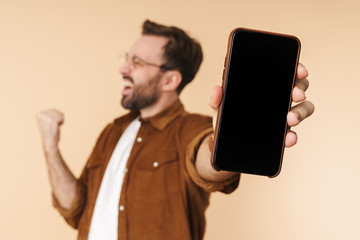 Wall Mural - Portrait of a cheerful young arttractive bearded man