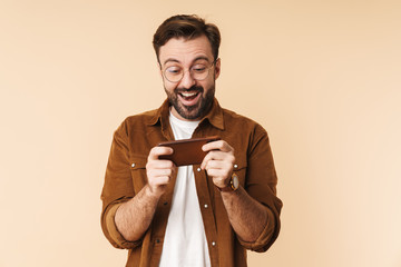 Wall Mural - Portrait of a cheerful young arttractive bearded man