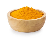 Turmeric Powder In Wood Bowl On White Background