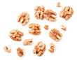 Peeled walnuts with slices on a white background. The view from top.