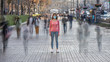 © realstock1 - The woman with medical face mask stands on the crowded street